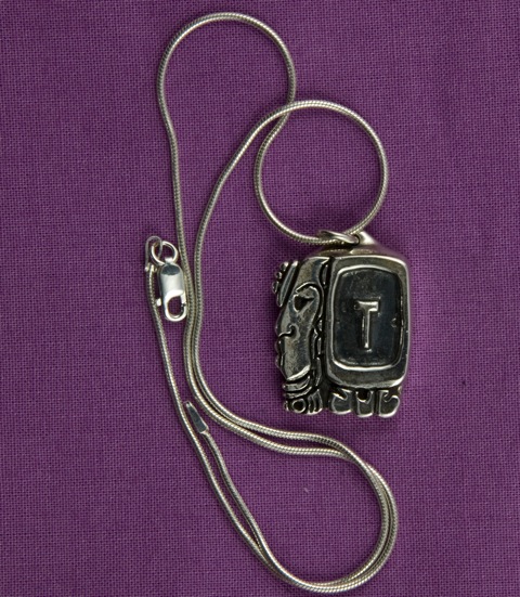 Sterling Silver pendant depicting the One Ik' daysign